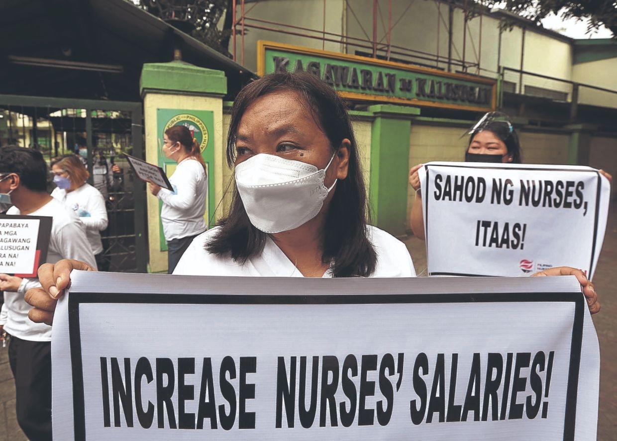 Health workers in Philippines demand higher pay, release of incentives
