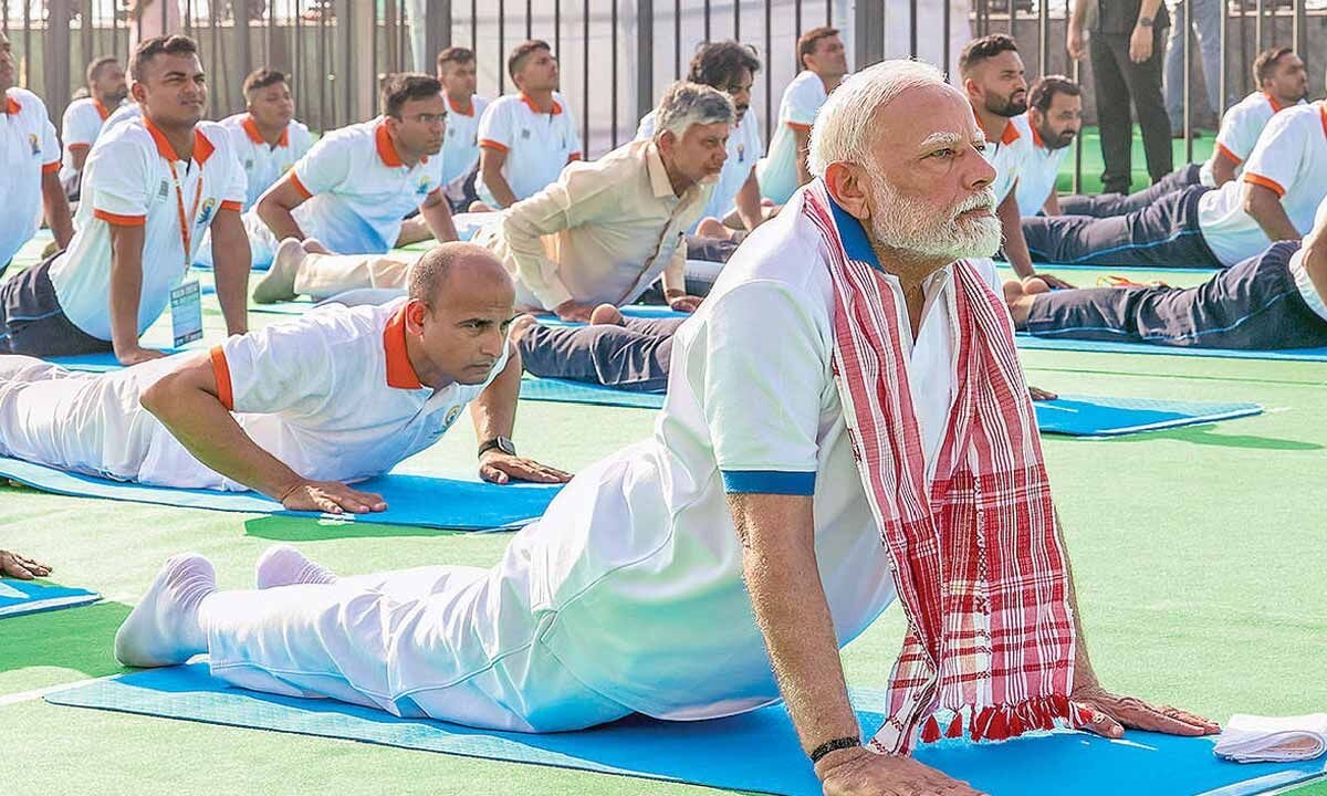 Yoga pause button for global tensions: Modi