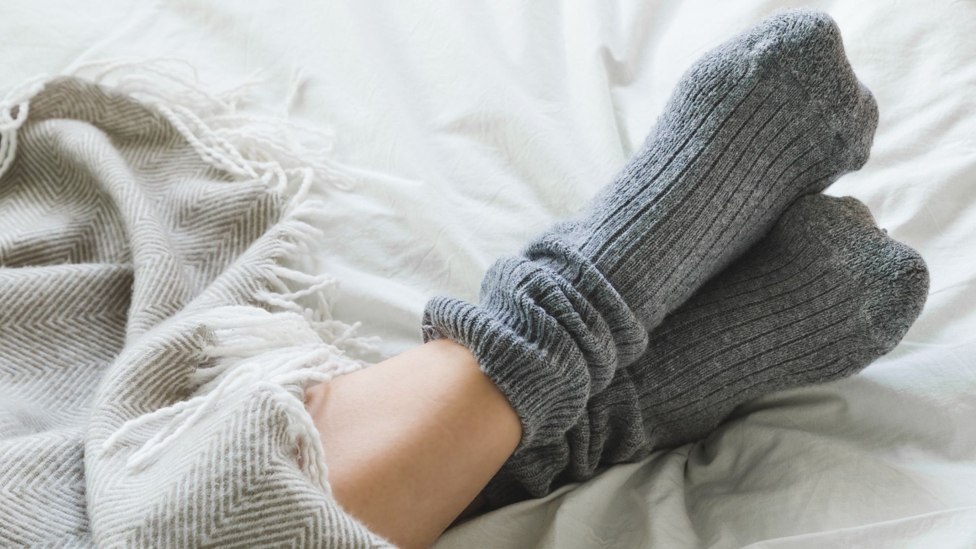 I wore wool socks to bed in the middle of a heatwave — now I swear by this summer sleep hack