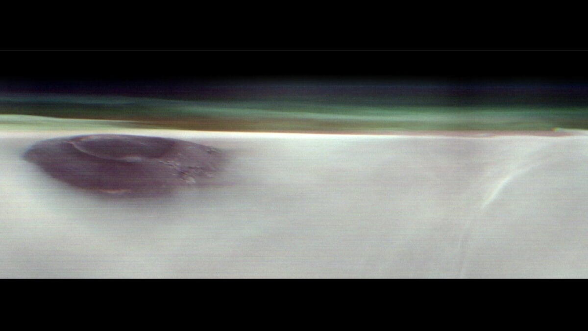 Mars Orbiter Captures Rare View of Ancient Volcano Poking Above the Clouds