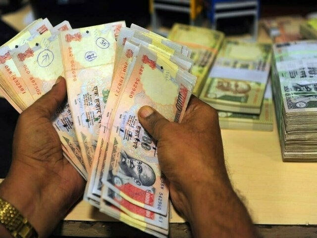Indian rupee gains slightly