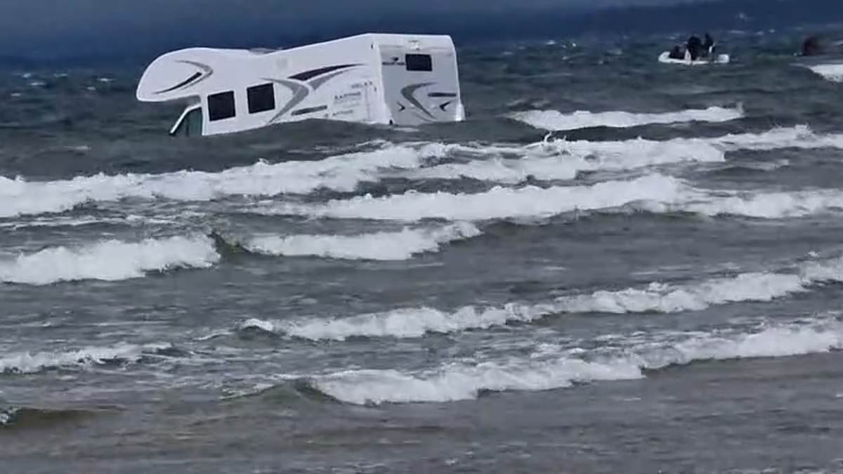 Two camper vans and a VW Beetle are submerged by the sea after owners 'ignored warnings of fast tide'