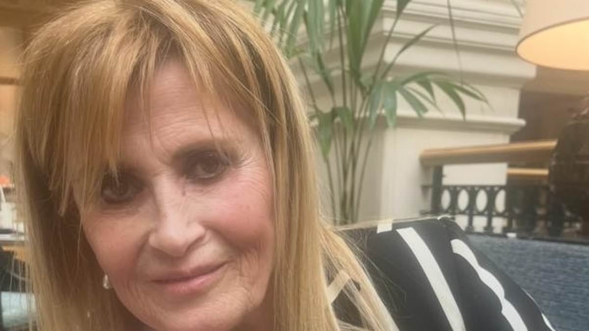 Woman, 66, arrested over murder of film director, 69, found dead in her flat with diamond Rolex missing