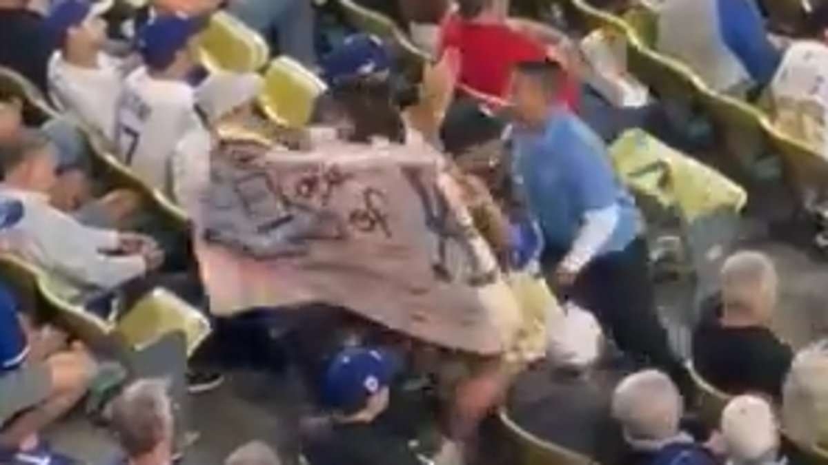 BREAKING NEWS Dodgers fan protesting ICE removed from game by security hours after agents descended on stadium