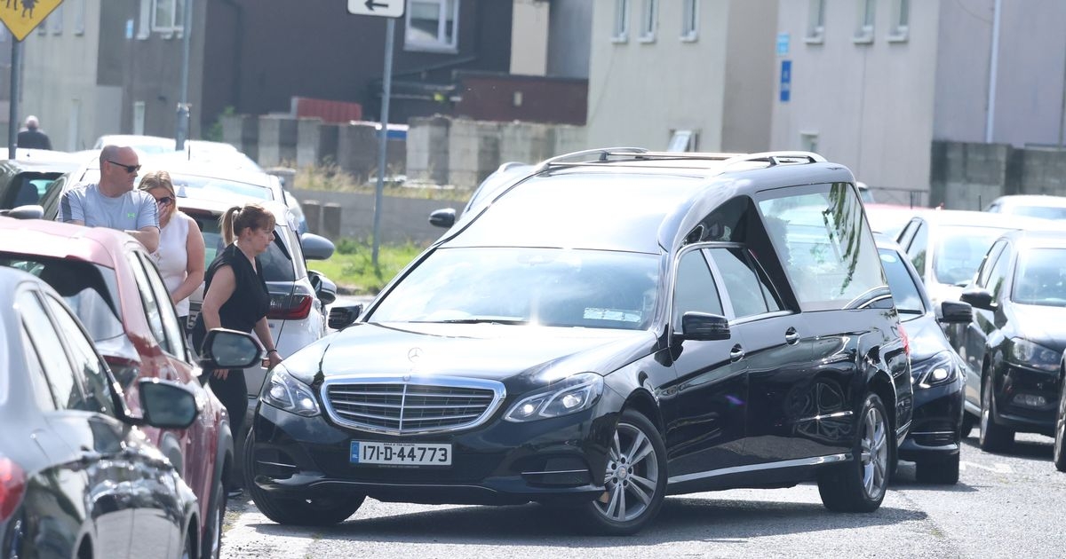 Tears flow at funeral to "kind hearted" dad