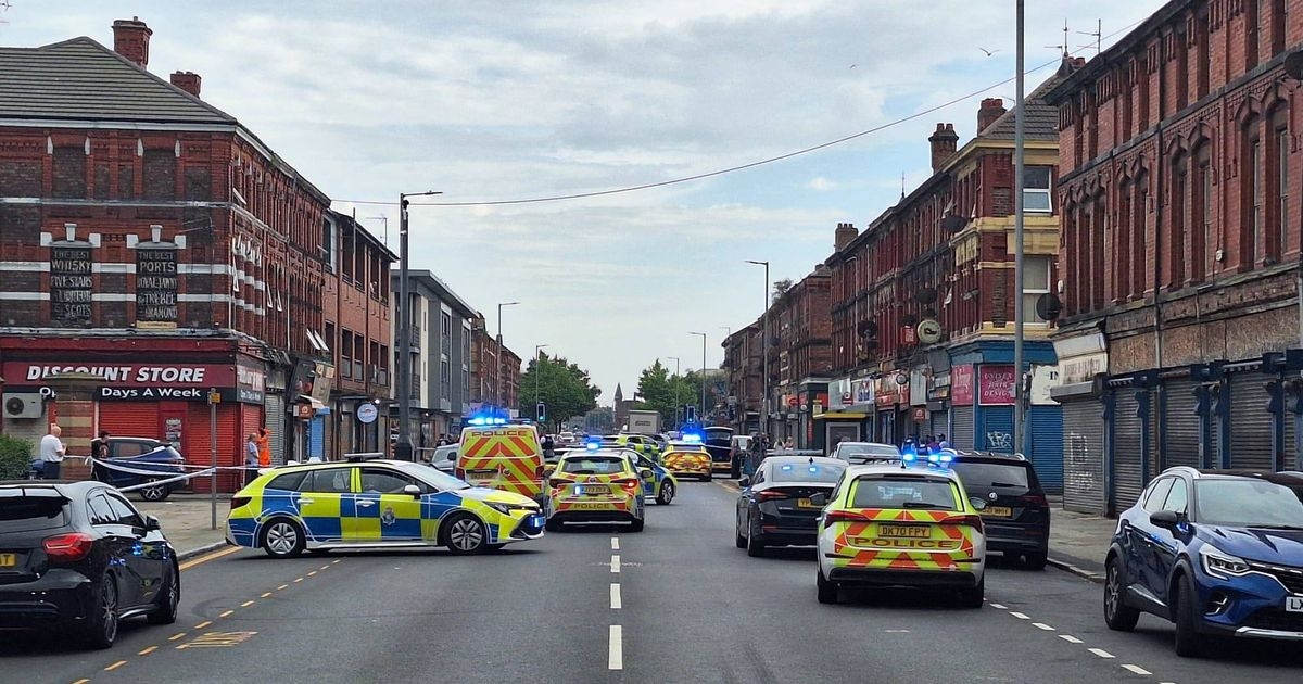 Man arrested on suspicion of murder after woman dies in shop attack