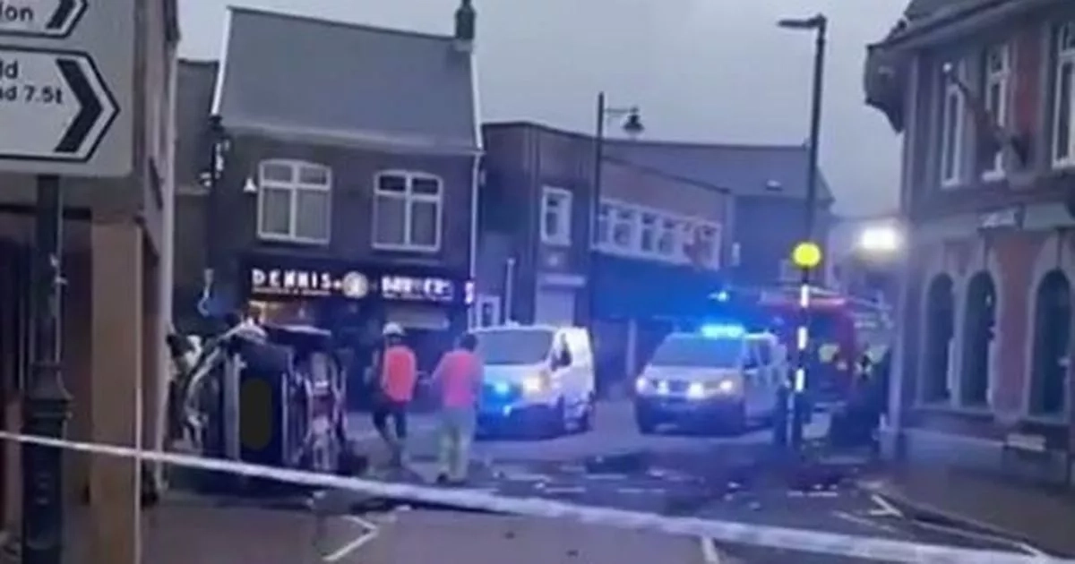 Man arrested after van collides with shop front in town centre