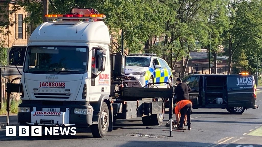 Man in hospital after police car and e-bike crash in St Ann's