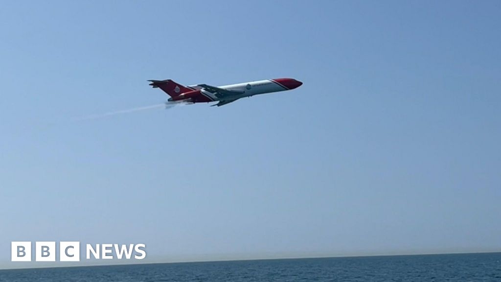 Low-flying airliner over Poole Bay in oil spill exercise