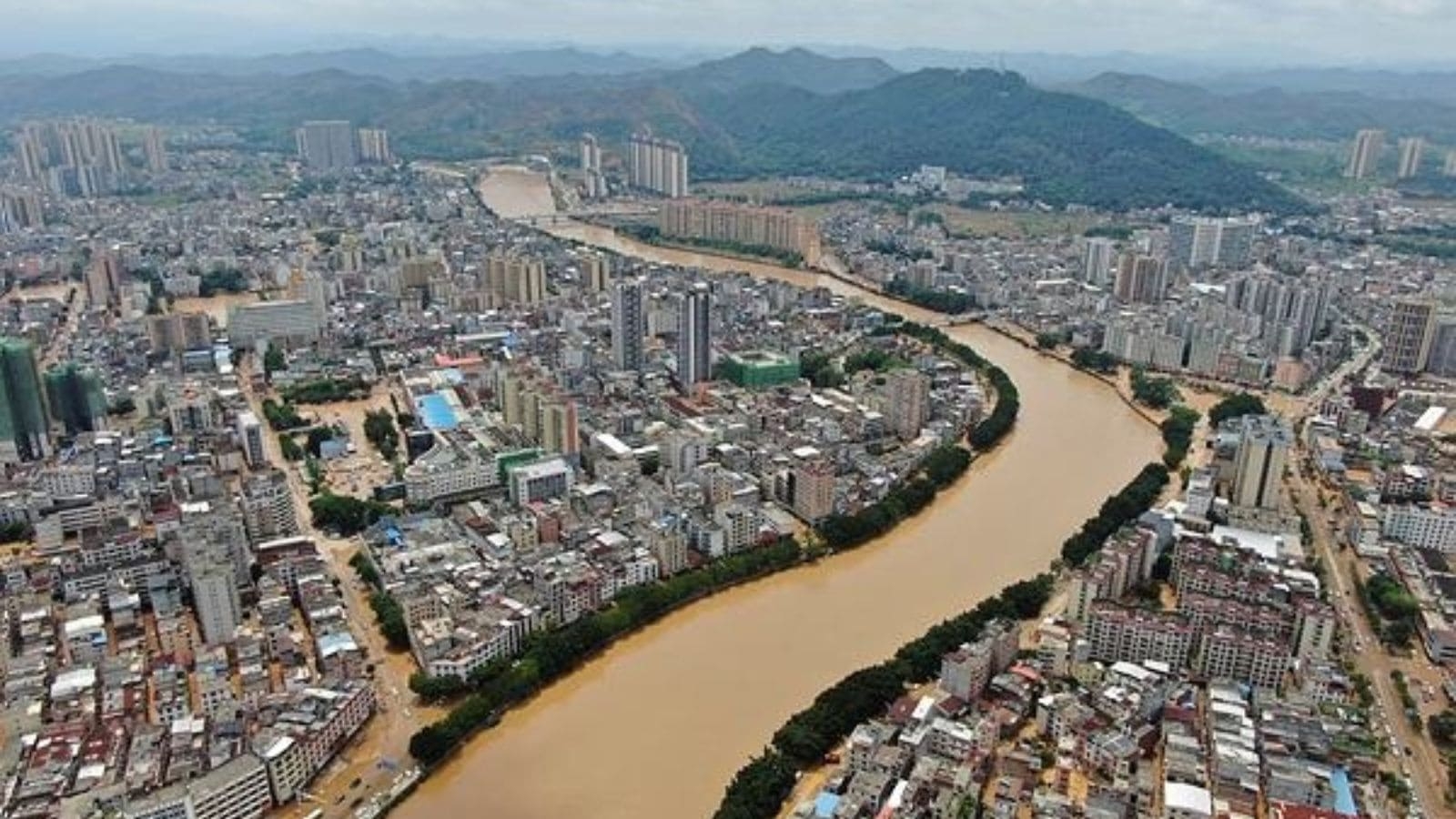 River overflows in southern China, stranding people, turning streets into canals Beijing