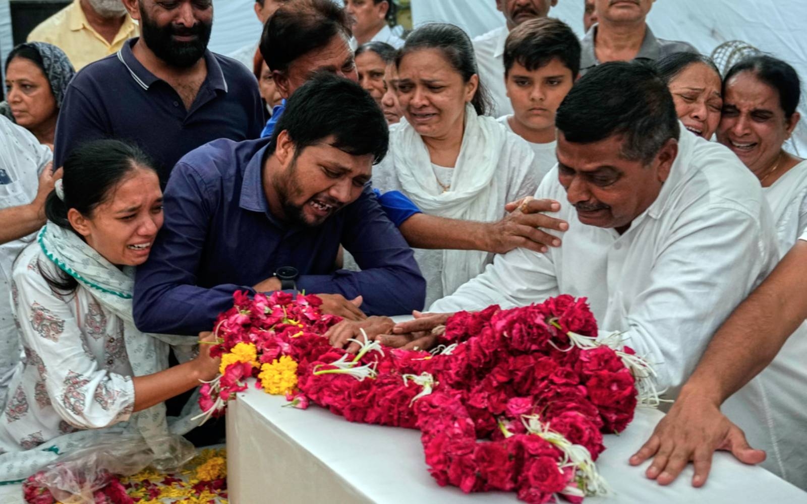 Relatives wait for remains after Air India crash