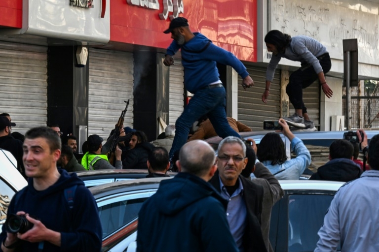 Syria security forces disperse rival protests in Damascus
