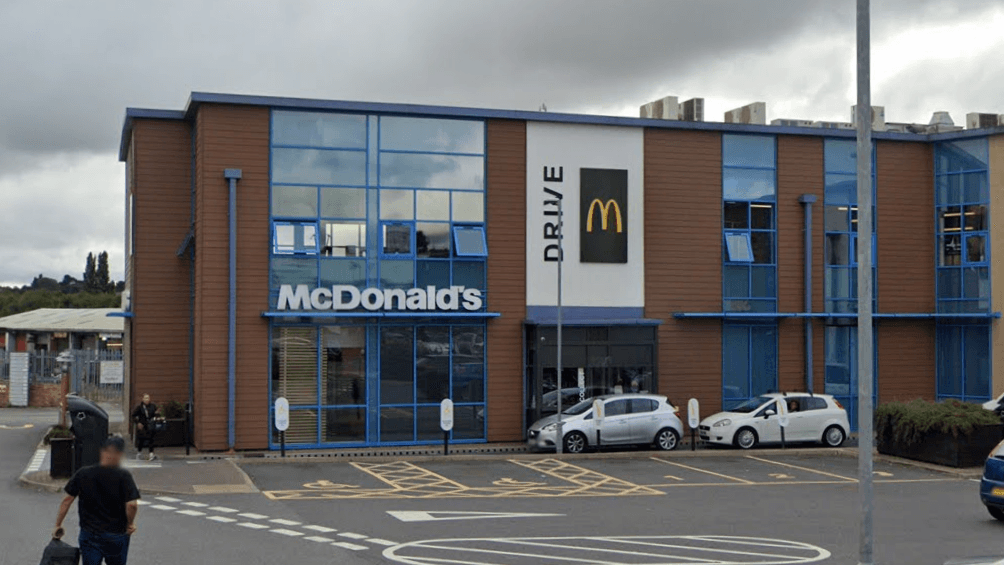 Driver held after man hit by car at McDonald's