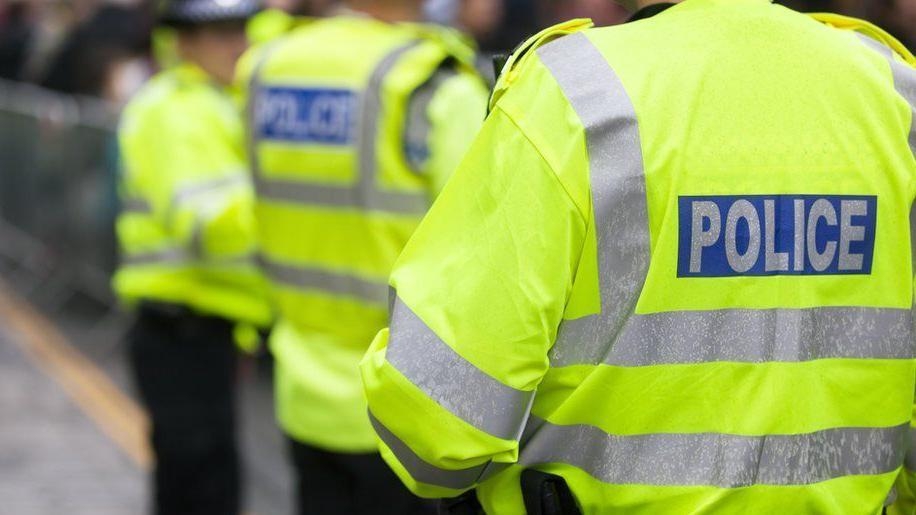 Two arrested after man shot at from car