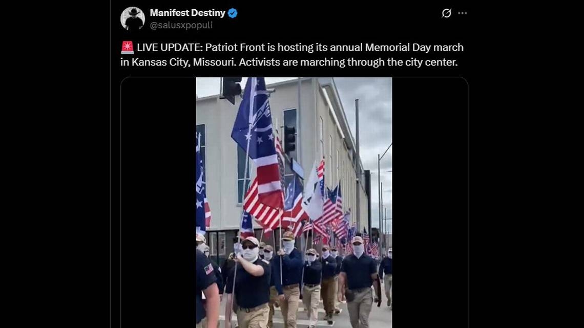 Masked Patriot Front white nationalists march Saturday in Kansas City