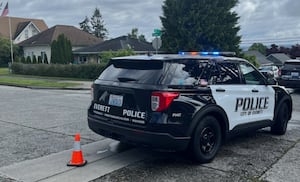 Everett police arrest woman after stolen vehicle crashes into building