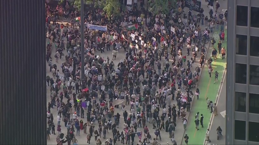 The Latest: More than 15 arrested in Tuesday ICE protests in downtown Chicago
