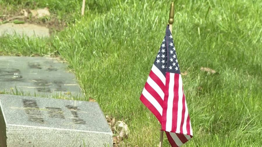 Flags placed on service members' graves at Lake View Cemetery for Memorial Day