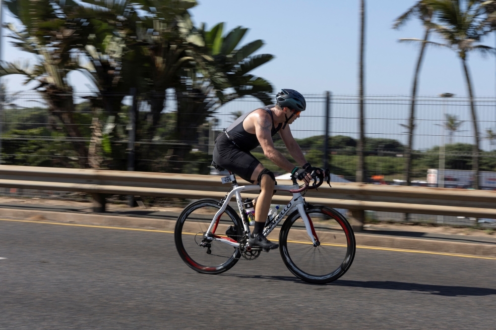 ‘Blade runner' back in the race: Oscar Pistorius competes in Durban triathlon a year after parole for killing girlfriend