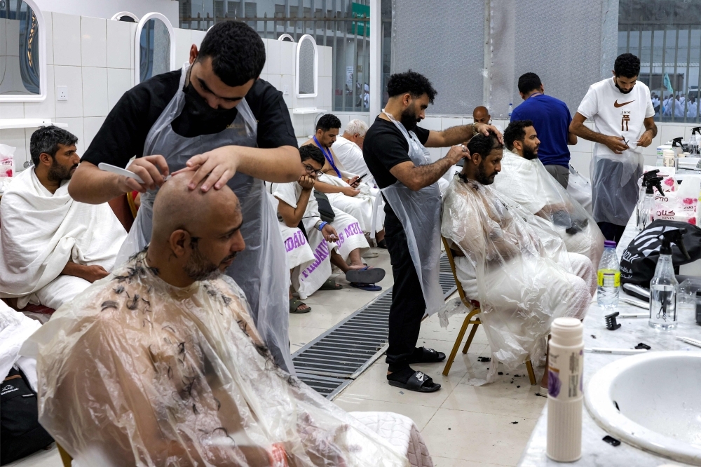 A sacred shear: Pilgrims line up for the Haj's humble finale