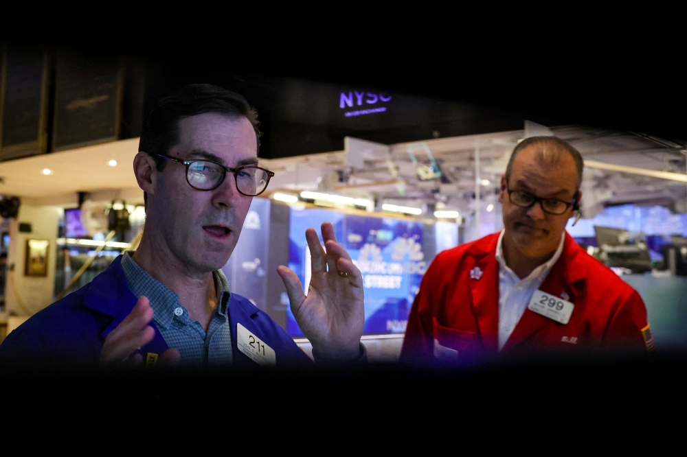Dow holds flat but Nasdaq slips as traders brace for more turmoil