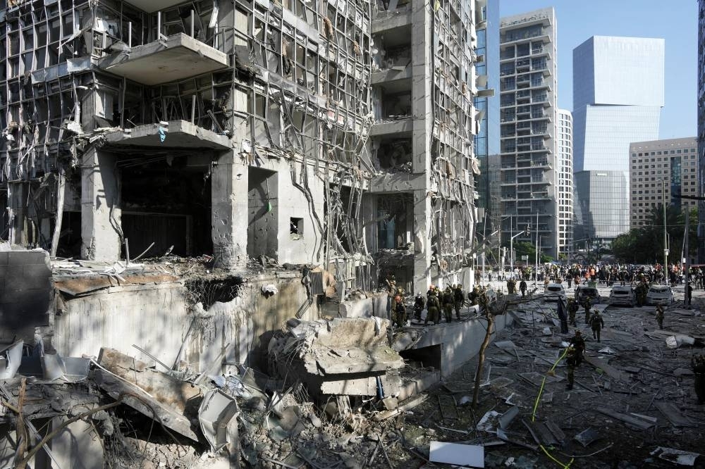 Israel attacks Iran's Arak reactor as Iranian missile hits hospital