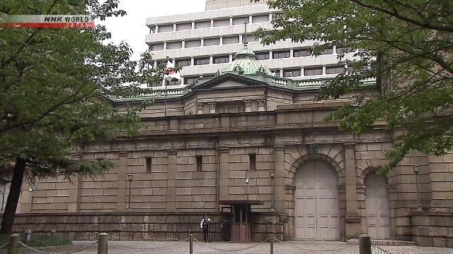 BOJ to slow cuts in bond buying in April next year